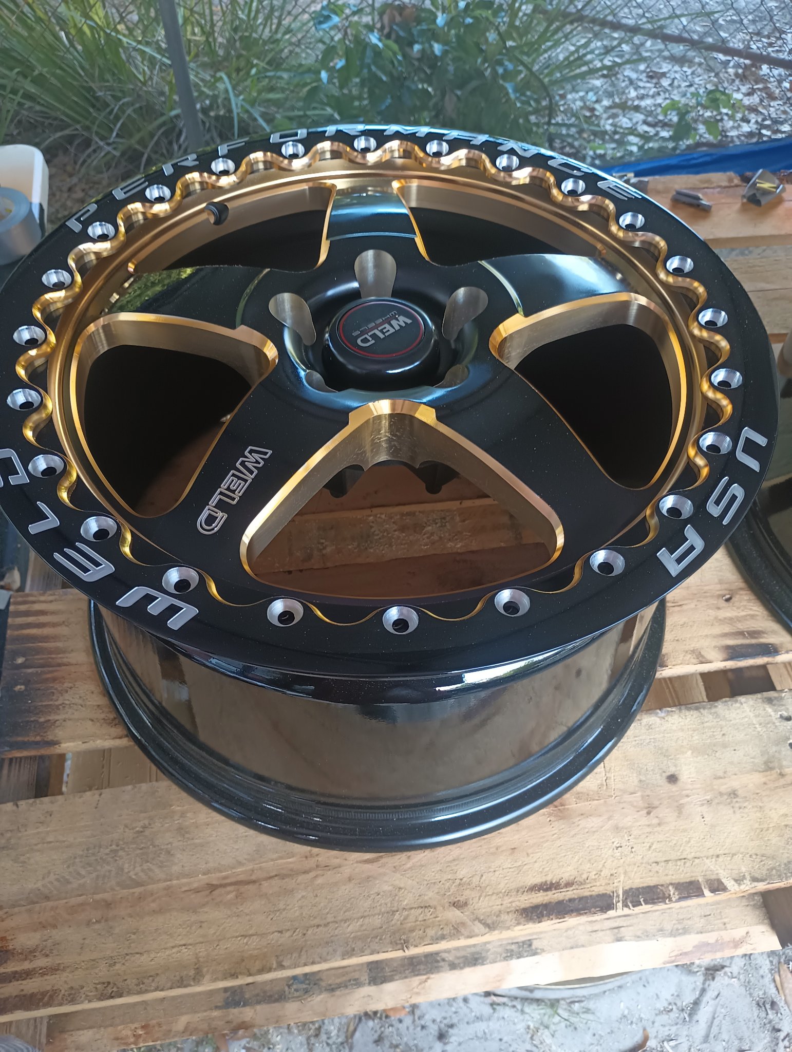 ChromeKarats gold plating work — Weld Performance Black & Gold Wheel — Beadlock Close-Up